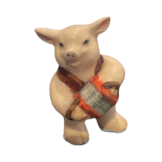 Pig porcelain figurine playing the accordian