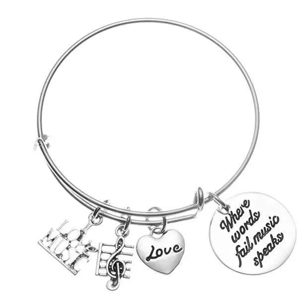 Music Bangle "Where Words Fail Music Speaks" with "Love Music" and Treble Clef Charm