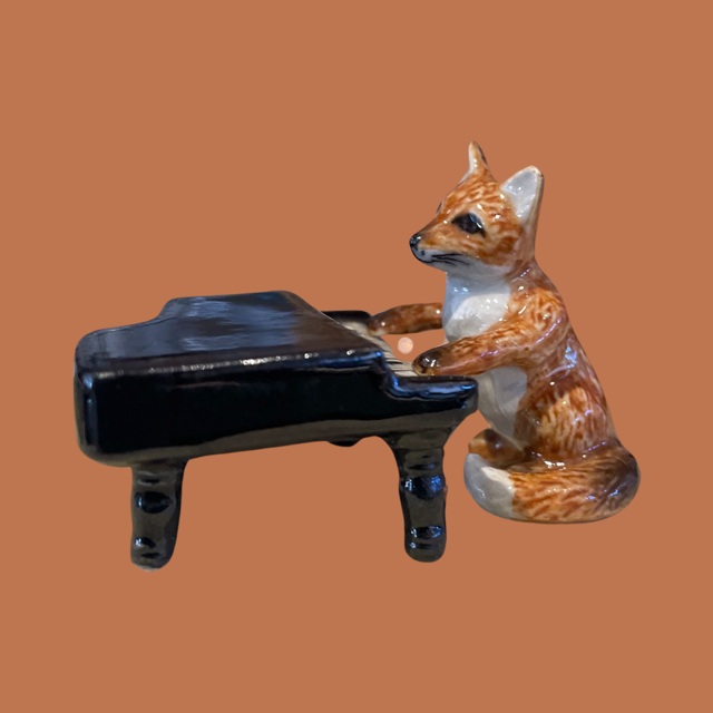 Porceline Fox Playing the Grand Piano